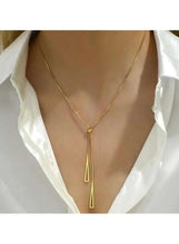 Gold-tone triangle pendant necklace with two long vertical drops