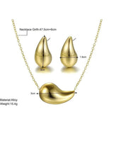 Gold-tone waterdrop jewelry set with teardrop stud earrings and crescent pendant necklace