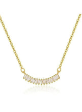 Gold tone bar pendant necklace with curved row of cubic stones