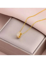 Gold-tone necklace with round crystal pendant on thin chain