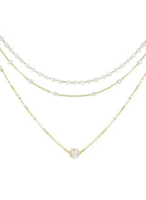 Triple-layer pearl choker necklace with three curved strands and small round beads
