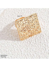 Gold geometric textured square ring on finger side view