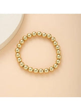 Gold tone pearl bead bracelet with round bead links