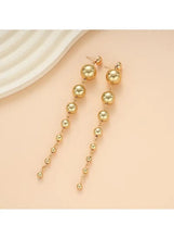 Gold tone pearl bead drop earrings with round ball beads and dangling strands