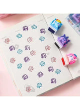 Cartoon pony stamp set shown stamping on paper with small self-inking pads