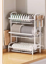 2-tier dish drying rack on countertop with cutlery shelf and side drain board