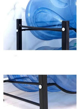 Black rack corner with screws and crossbar, holding clear blue water jugs.