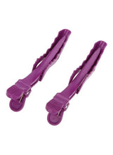 Purple crocodile hair clips with spring clamp and textured grip pads, pair view