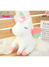 White unicorn plush toy in a seated pose, pastel horn, rainbow tail, stitched eyes