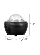 Black star projector night light with clear dome and side speaker grille