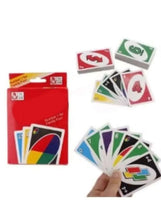 Card game box and loose deck of colorful numbered cards in a hand