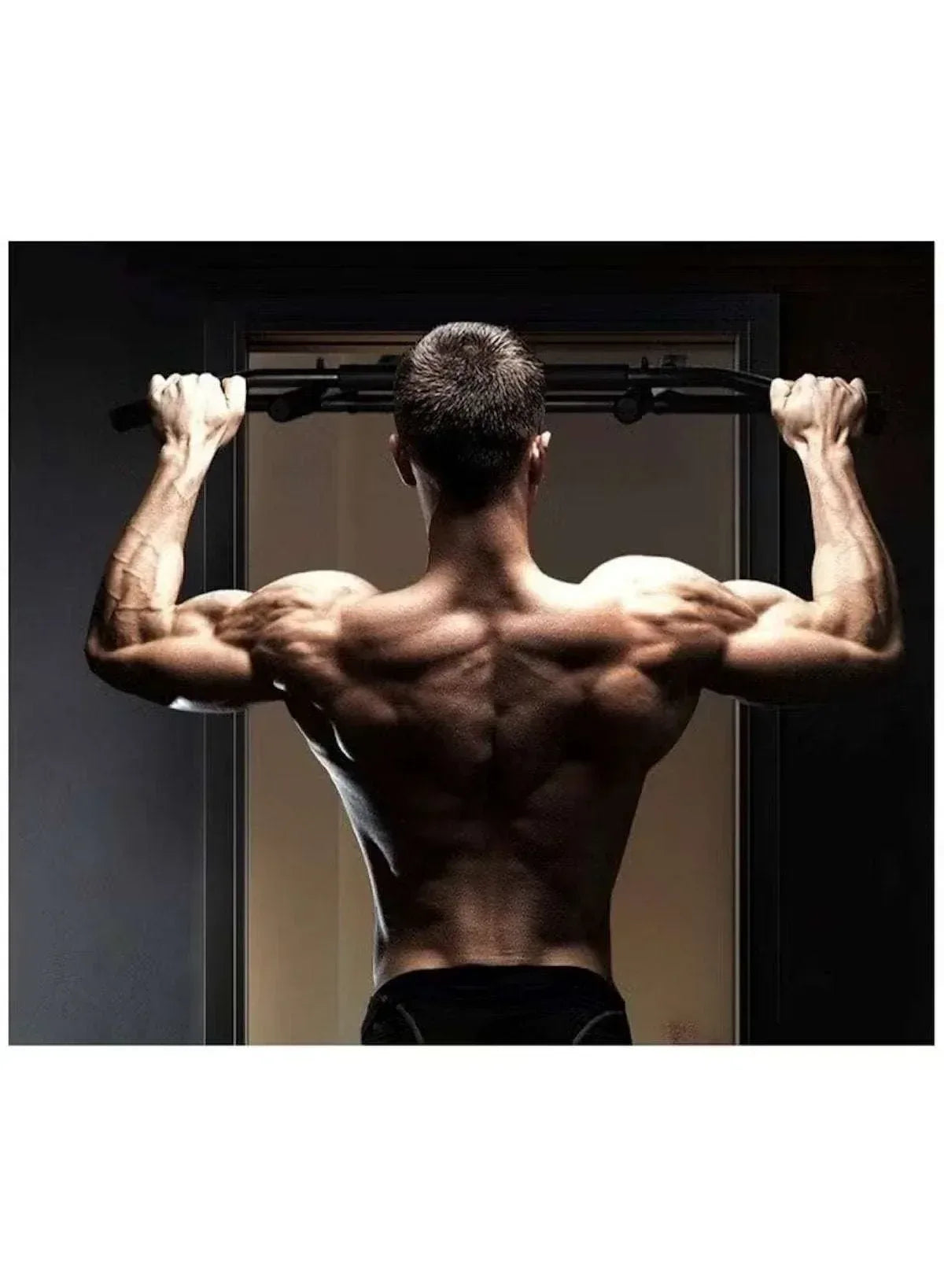 Black steel push-up bars with sponge grips mounted on a doorway bar