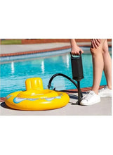 Black hand air pump with hose nozzle at inflatable valve