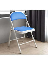 Blue folding chair with leather-style seat and backrest, compact indoor view