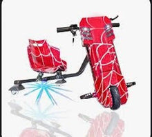 Red electric drift trike with spider-web design, small seat and side handlebars