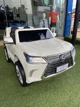 White electric ride-on SUV with rubber tires, front grille and headlight detail