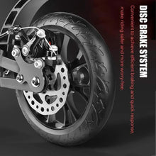 Front wheel disc brake rotor and tire tread on black kick scooter