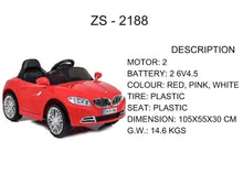 Red kids electric ride-on car, side front view, black windshield and seats, chrome wheels.
