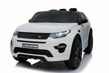 White electric ride-on SUV front view with LED-style headlights and black grille