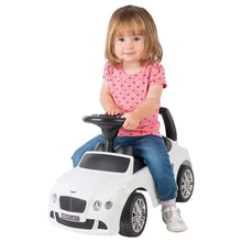 Red ride-on push car with black steering wheel, padded seat, and front grille