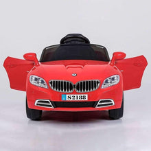 Red kids electric ride-on car, front view with open doors, chrome wheels, black steering.