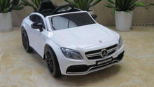 White kids electric ride-on car with Mercedes grille, black wheels and seats