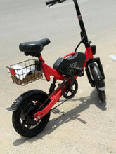 Red foldable electric bike with front basket, black headlight, and fenders