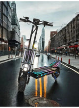 Black electric scooter with blue accents and RGB lights, front view with headlight on