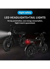 Electric bike with LED headlight and red tail light on dark wheels and frame.