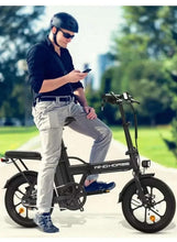 Folding electric scooter with rider, black frame and 16-inch wheels