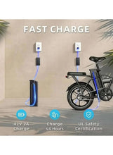 Folding electric bike with charging cable connected to an outlet, black frame, 16-inch wheels