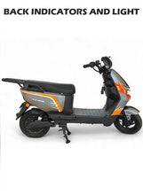 Electric scooter for adults, black deck with orange accents and rear storage bag