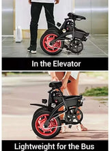 Black folding electric scooter with red wheel rims standing indoors