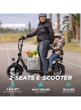 Black electric scooter with dual seats and wire cargo basket, shown on a road.