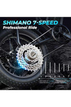 Rear wheel close-up of electric bike with disc brake rotor and sprocket