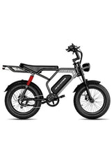 Black electric fat-tire bike with front headlight, rear rack, and dual suspension