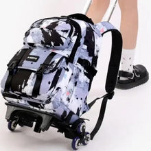 Wheeled kids backpack close-up with splatter print, padded back panel and rolling wheels