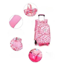 Pink kids wheeled backpack with geometric print and wheel-and-handle detail views