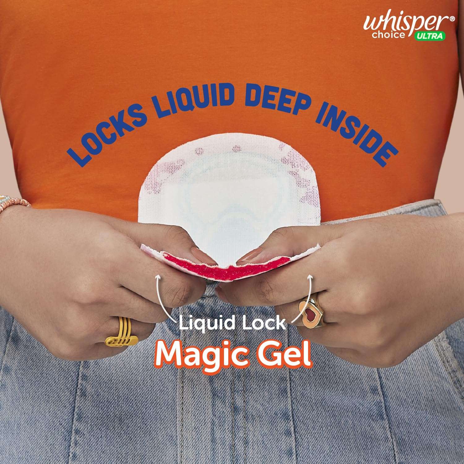 Whisper Choice sanitary pads XL showing hands squeezing pad with red liquid absorbed by Liquid Lock magic gel