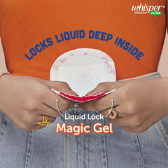 Whisper Choice sanitary pads XL showing hands squeezing pad with red liquid absorbed by Liquid Lock magic gel