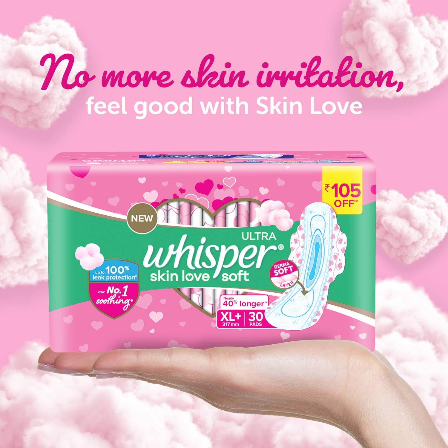Hand holding pink packaging of Whisper Ultra Soft Sanitary Pads XL Plus with Skin Love cottony design