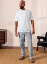 Cotton short sleeve T-shirt in white on model, crew neck front view.