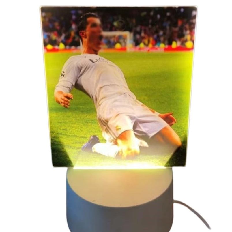 Huitich white football player desk lamp featuring a glowing image of a soccer player in white uniform sliding on the field