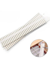 White drawer separator organizer with long divider strip and evenly spaced notches.