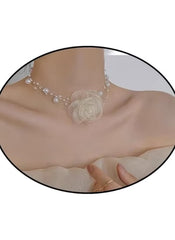 Huitich white rose choker necklace with delicate pearls and floral centerpiece on model