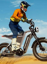 Electric mountain bike with integrated battery, fat tires, front fork suspension and headlight
