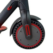 Front wheel hub and fender of red-and-black electric scooter with circular tread