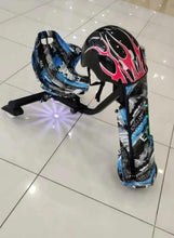 Kids electric scooter with blue/black graphics and two safety helmets