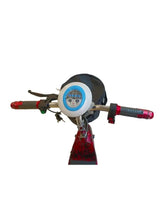 Red patterned 3-wheel electric mobility scooter with round blue headlight and black handlebar cover