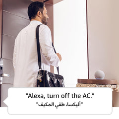 Man using wireless video doorbell with smart speaker to control home devices by voice command